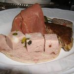 That puck of housemade liverwurst is exquisite, as is the triangle of crispy pork terrine. Creamy, crunchy, fatty and shot through with tiny Sicilian pistachios, it's like the scrapple of the gods. If you dig offal, don't look too closely because you can see ribbons of ear. Then again if a little pig ear bothers you, youâre probably not a big scrapple fan. The housemade Serrano-style ham and mortadella are also quite good.